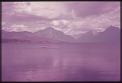 E-32 = Across McDonald Lake from Belton. Glacier Park's Peaks in Background.  C.W. Cushman