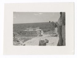 Thumbnail for Item 1004. - 1004a. Various shots of Eisenstein with Alexandrov, Tissé and an unidentified man (separately) on the upper platform of the Castillo. Eisenstein seated or kneeling at corner of platform, other men standing behind camera.