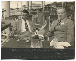 Coughlan and Murphy sitting at table at Eden Roc